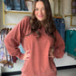 Soft, slouchy, and seriously cozy. The&nbsp;Rust Pigment Dyed Pullover by Zenana is your new favorite weekend essential. Made from 100% cotton French terry, it has that perfectly worn-in feel with a pigment dye finish that gives it a subtle, vintage-inspired depth of color unique to each piece.

Ribbed detailing adds a polished touch, and the handy pockets make it as practical as it is stylish. Whether you're running errands or lounging at home, this relaxed pullover does it all in effortless dusty blue.

D