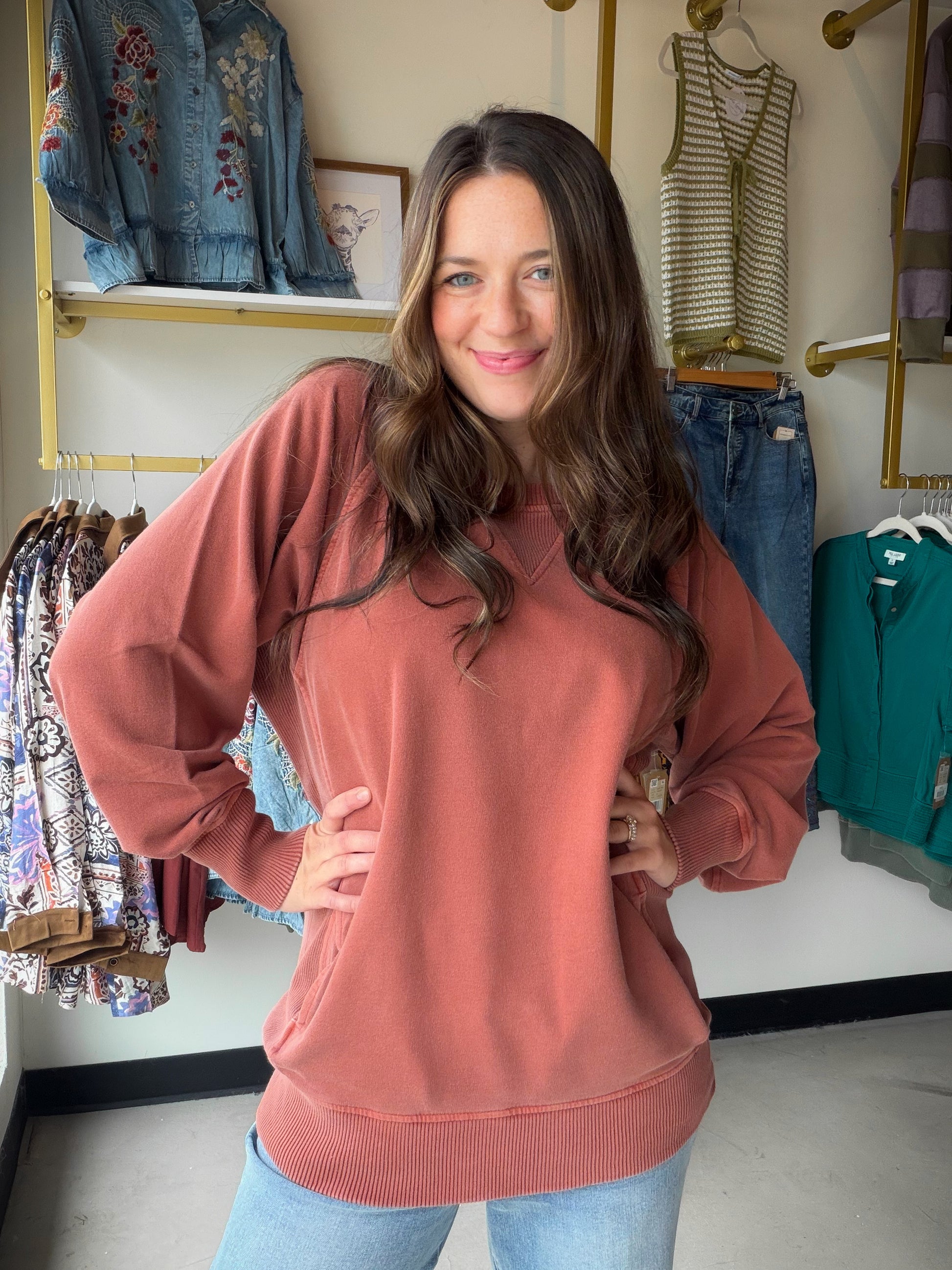 Soft, slouchy, and seriously cozy. The&nbsp;Rust Pigment Dyed Pullover by Zenana is your new favorite weekend essential. Made from 100% cotton French terry, it has that perfectly worn-in feel with a pigment dye finish that gives it a subtle, vintage-inspired depth of color unique to each piece.

Ribbed detailing adds a polished touch, and the handy pockets make it as practical as it is stylish. Whether you're running errands or lounging at home, this relaxed pullover does it all in effortless dusty blue.

D