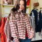 The Rust &amp; Mocha Plaid Jacket features a fully lined interior, ensuring comfort and durability throughout the season. Its boxy fit provides a modern silhouette while allowing ease of movement. Designed in rich fall tones of rust and mocha, this jacket effortlessly complements autumn wardrobes. Practical front pockets add functionality without compromising style, making it an essential outerwear piece for transitional weather.