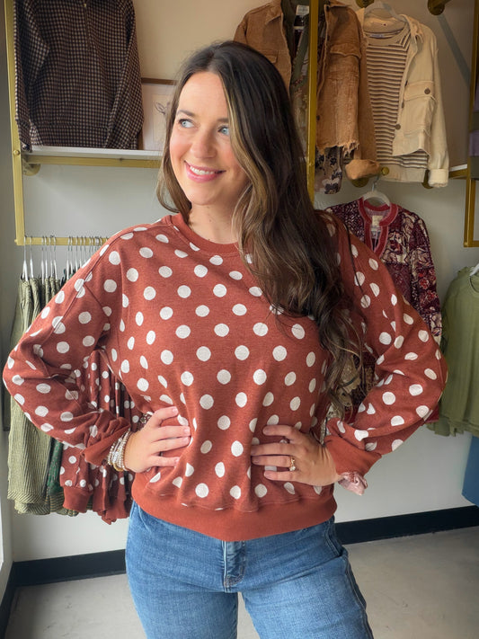 Umgee

Like petals scattered across a quiet breeze, the Polka Dot Printed Pullover carries a playful softness wrapped in calm simplicity.

Key Features:
Not Lined
Polka dot design
Back-side pleat detail

Fabric Contents:
40% Cotton
35% Rayon
20% Polyester
5% Spandex
