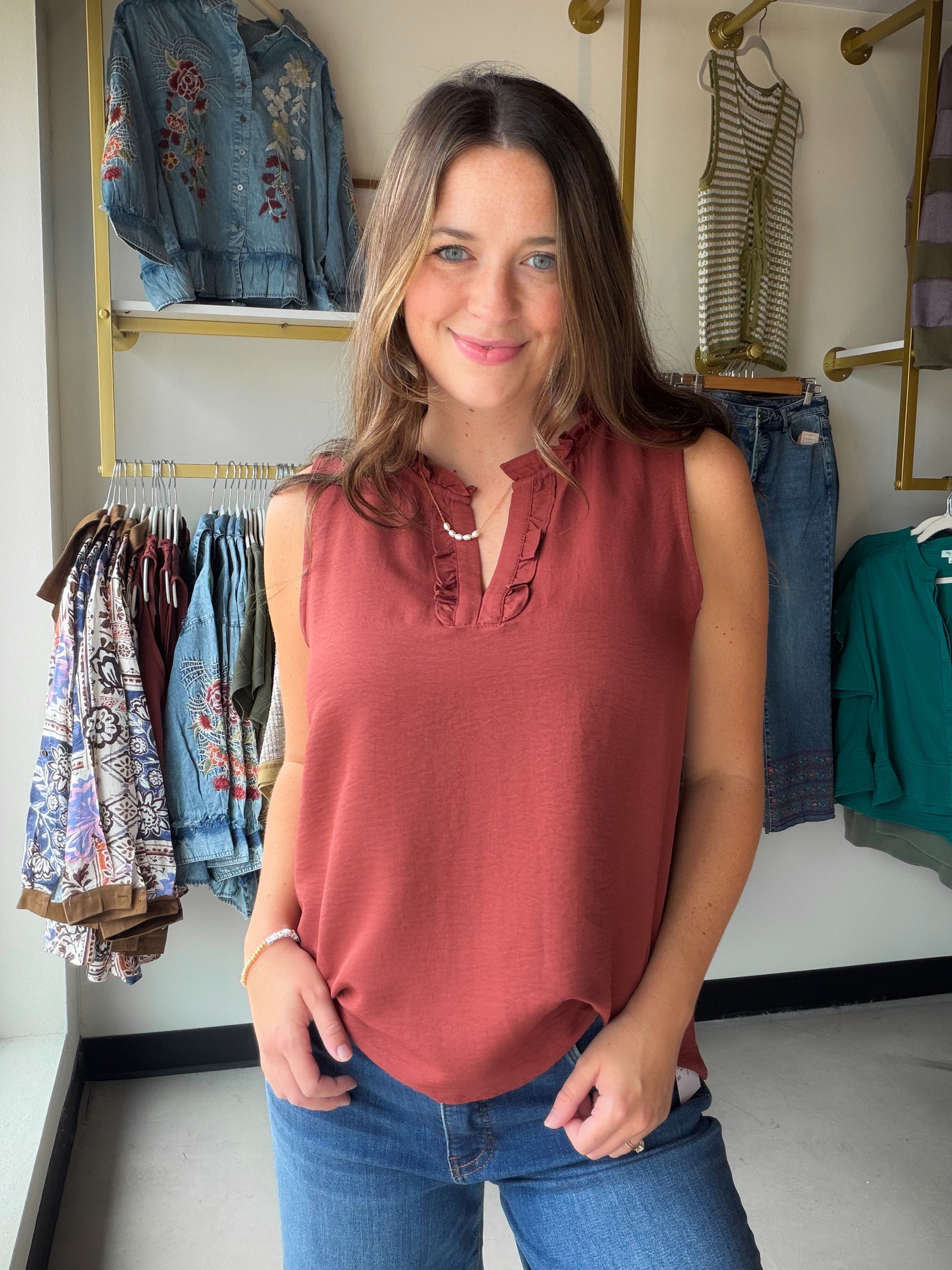 Effortlessly feminine and ready for anything, the Ruffle Detail Sleeveless Top by Staccato is the kind of piece you'll reach for again and again. A rich copper hue pairs with delicate ruffle detailing for a look that feels polished without trying too hard.

The sleeveless silhouette keeps things cool and versatile — tuck it into your favorite trousers for the office, or style it with denim for a weekend out. Light, flowy, and easy to wear all season long.

Ruffle detail, sleeveless woven top
100% Polyester 