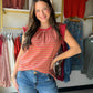 A warm rust stripe meets playful ruffle-knit texture in this easy sleeveless top. The banded hem and crew neckline give it a polished finish, while the cotton-blend fabric keeps it comfortable and breathable all day. Dress it up with white denim or keep it casual — either way, it's a warm-weather win.

Sleeveless crew neck silhouette
Ruffle knit texture with stripe detail
Banded hem for a clean, flattering finish
95% Cotton, 5% Spandex — soft with a hint of stretch
Easy to style up or down