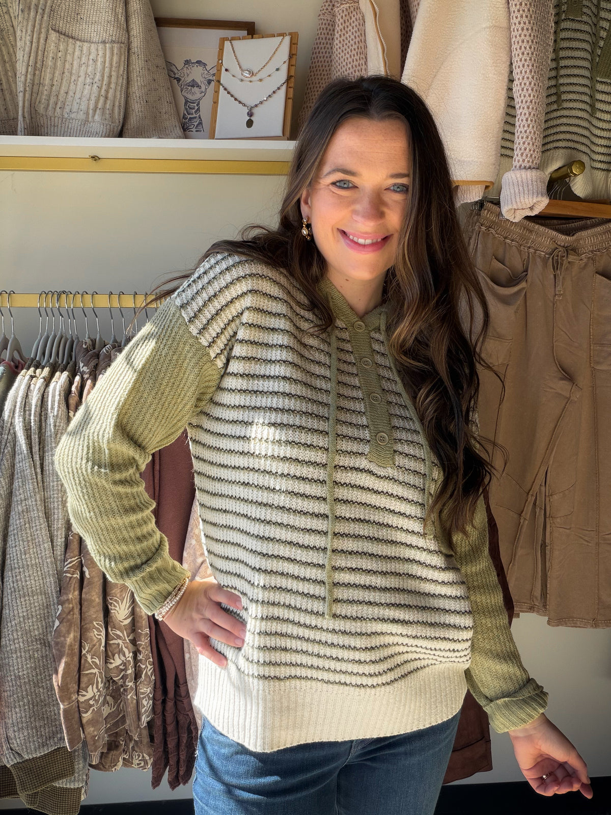 A Fresh Take on Sweater Days

The Sage Stripe Button Sweater Hoodie by Staccato brings a little personality to your everyday sweater lineup. Sage tones, color-blocked stripes, and button detailing create a look that feels playful yet easy to style, while the hood adds a casual finishing touch.

Picture a weekend coffee stop followed by an afternoon browsing your favorite shops. Pair this sweater hoodie with denim and sneakers for a laid-back outfit, or style it with cream pants and ankle boots when you want