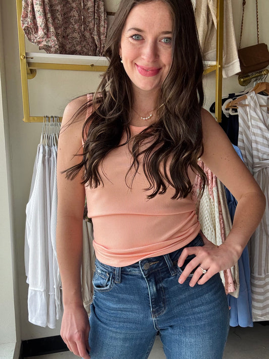 The&nbsp;Hold Tight OG Tank&nbsp;is the original, the icon, the MVP of your wardrobe lineup. With its buttery-soft fabric and just-right stretch, this tank hugs you in all the right places while keeping you comfy all day long. The classic scoop neckline and sleek silhouette make it the perfect layering piece or a standalone stunner on warmer days.