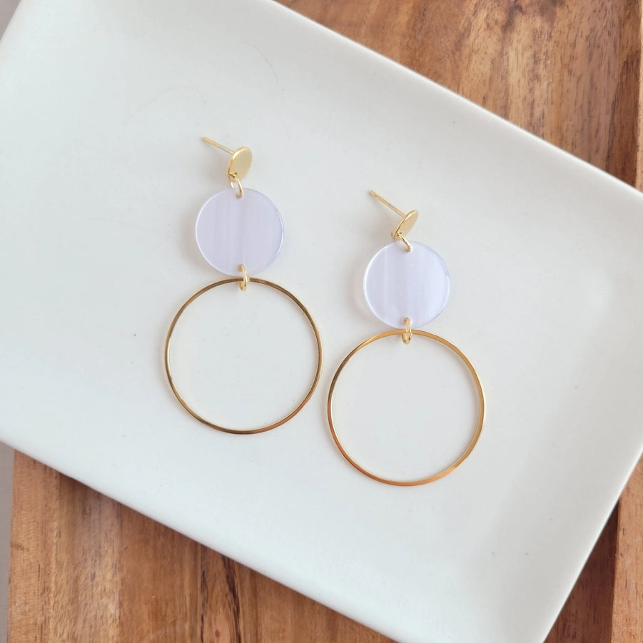 Sadie is a statement dangle style that features a large gold charm for a hoop look! You'll get a perfect pop of color from the acrylic charms. * 18k gold-plated stainless steel posts and charms * Lightweight and durable acrylic charms in Silver