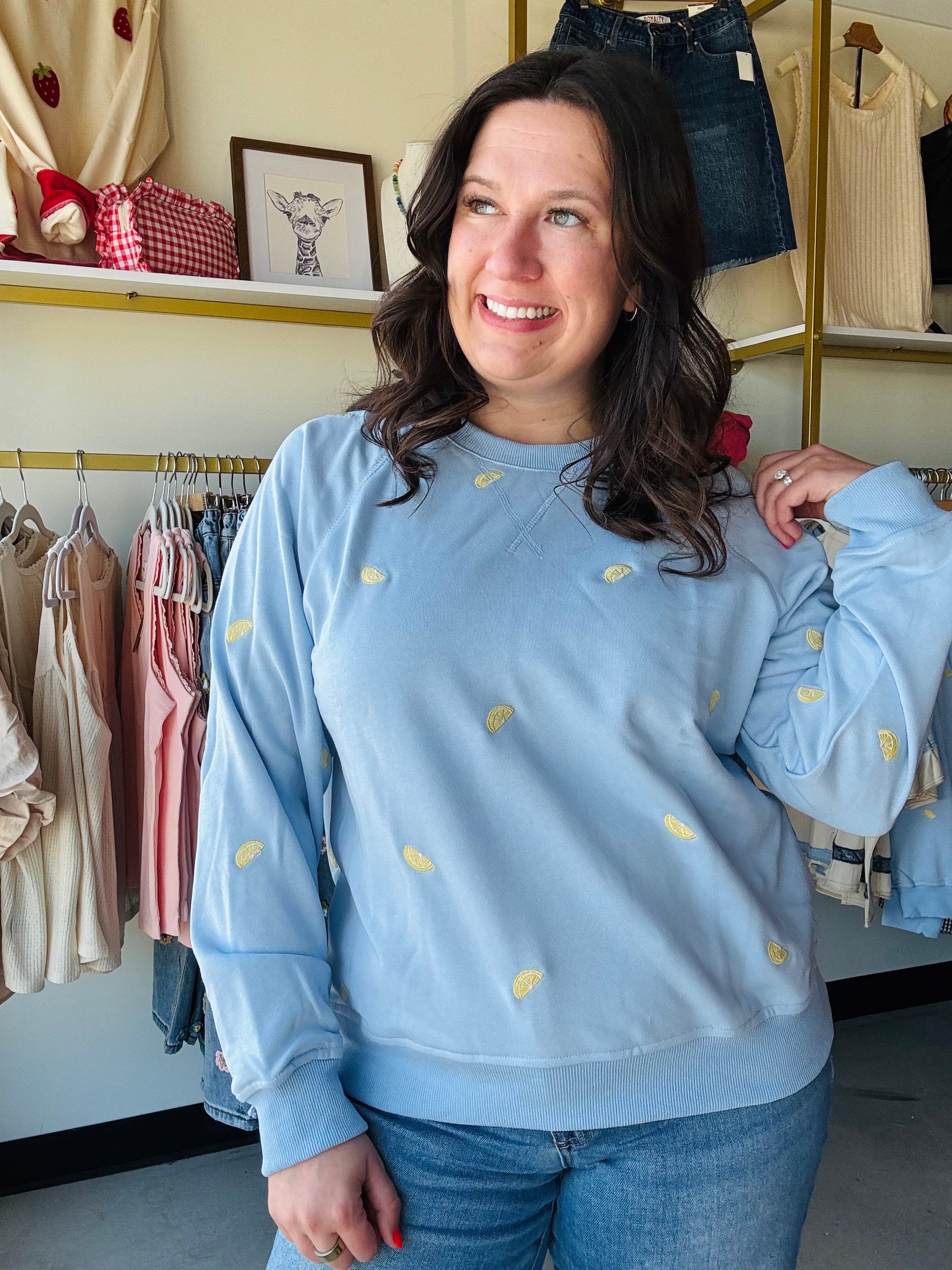 Sunday Edition

Brighten your day with this ultra-soft, sky-blue crewneck featuring delicate lemon slice embroidery. Perfectly blending coastal charm with premium comfort, it’s your new go-to for effortless, sun-kissed style

Intricate embroidered lemon slice detailing.
Dreamy, versatile sky blue hue.
Relaxed raglan sleeves for comfort.
Buttery-soft, breathable premium fabric.
Flattering ribbed cuffs and hem.
Effortless styling for every season.
Durable stitching for lasting quality.
