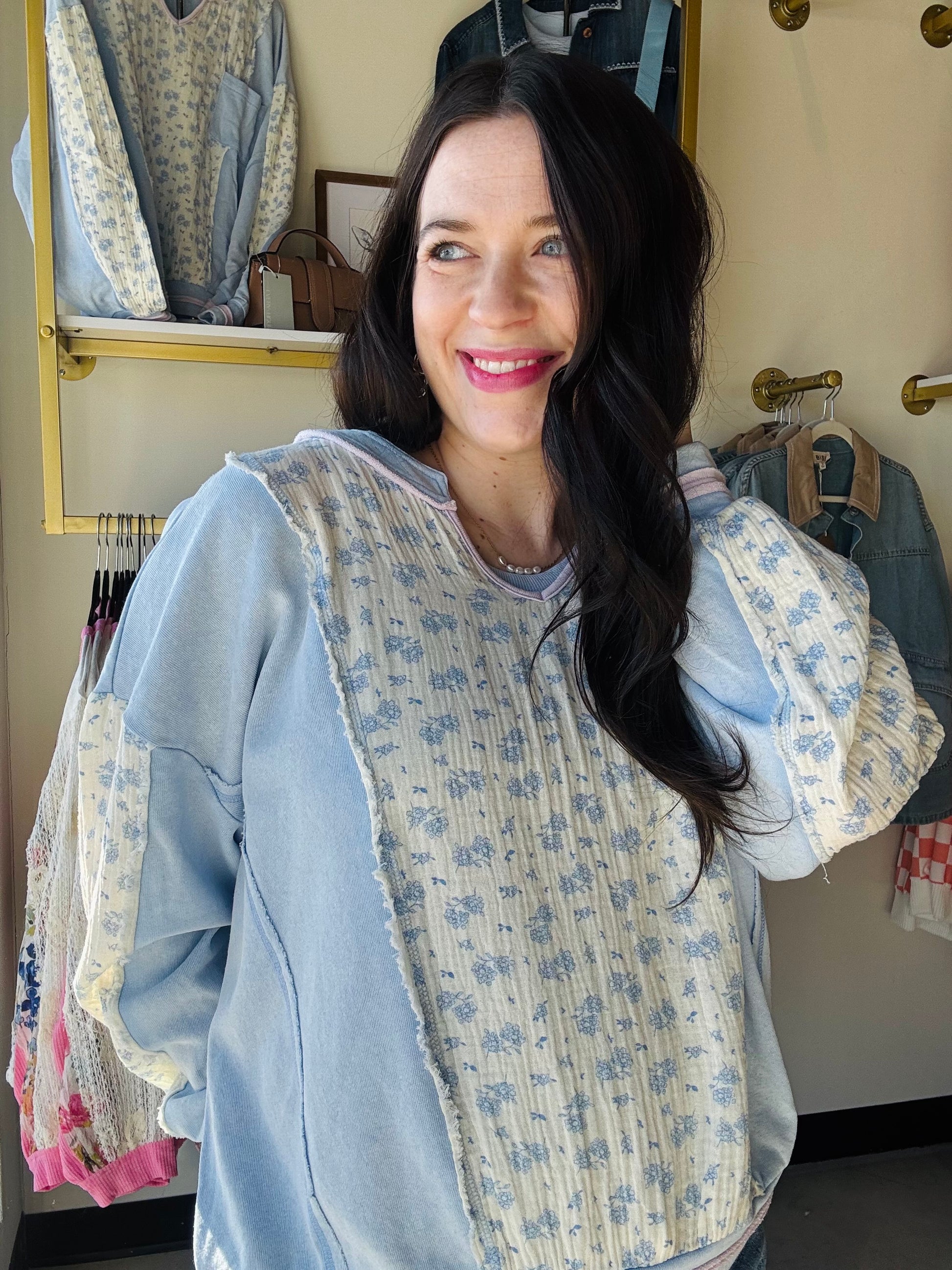 Hem &amp; Thread&nbsp;

This relaxed terry top combines comfort with understated elegance. Crafted from soft cotton, it features a flattering scoop neck, functional front pocket, and exposed hems for a contemporary edge. Delicate floral embroidery in lilac adds a charming detail, while coordinating piping accents the neckline. Perfect for layering or wearing solo, this versatile piece transitions effortlessly from casual days to cozy evenings.