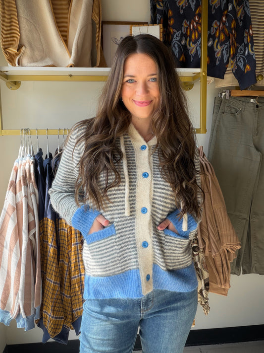 The hoodie, elevated. The&nbsp;Blue Gray Contrast Button Hoodie by Staccato takes your favorite relaxed silhouette and gives it a boutique twist — a cool blue-gray colorway with contrast button detailing that makes it look intentional, not just thrown on. Soft, stretchy fabric with just the right amount of ease for all-day comfort that still looks put together.

Why You'll Love It

Blue-gray colorway — a cool, versatile neutral that pairs with everything
Contrast button detailing — the elevated touch that s