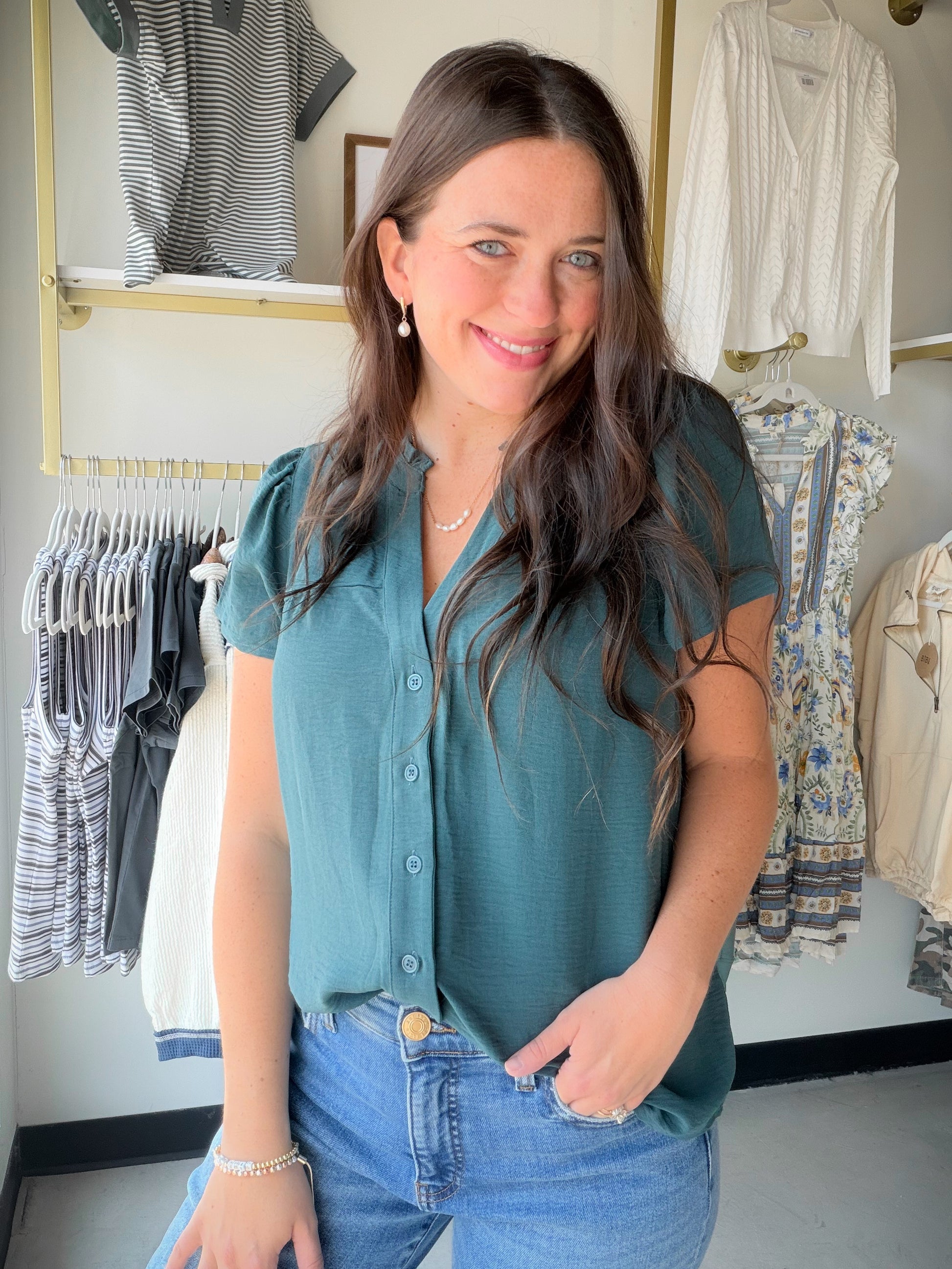 Meet your new go-to blouse for effortless, feminine style. The Dark Jade Ruffle Sleeve Blouse features delicate ruffle sleeves that add a soft, romantic touch to any look — whether you're dressing it up for a night out or keeping it casual for brunch with the girls.

Imagine slipping into this rich dark jade hue and feeling instantly put-together. The lightweight, flowy fabric drapes beautifully and moves with you all day long.

Ruffle sleeve detail for a feminine, elevated look
Rich dark jade colorway — ve