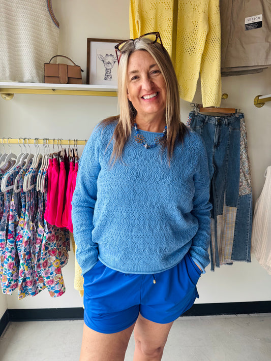 Elevate your everyday style with this Royal Crochet Pointelle Sweater. Featuring an intricate crochet-like pointelle knit, this pullover offers a delicate, textured look that's both sophisticated and effortlessly chic. The wide neckline provides a relaxed, flattering fit, while long sleeves offer versatile layering for any season. Perfect for dressing up or down, this sweater combines comfort with contemporary design.