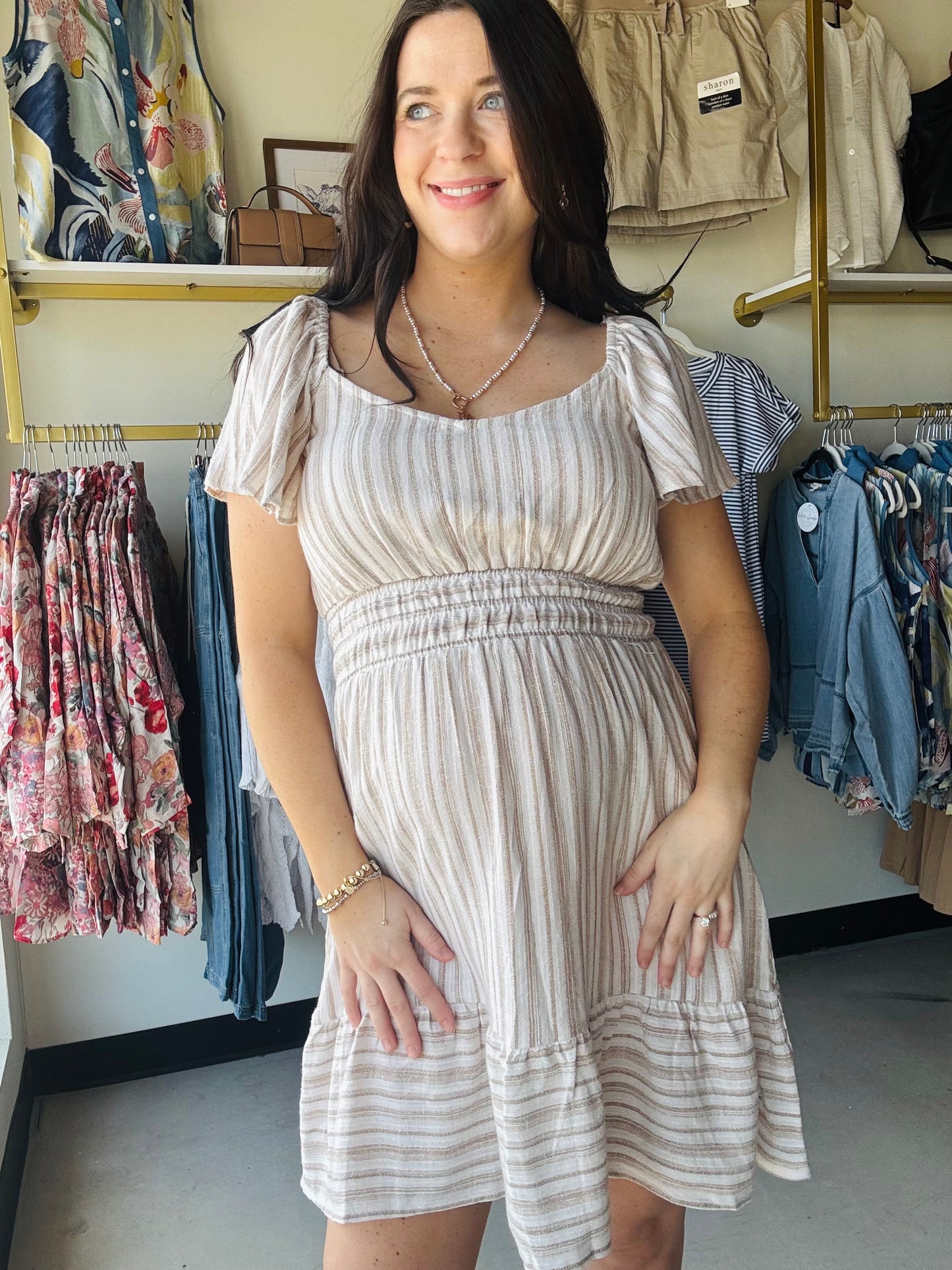 Staccato

Elevate your sun-drenched wardrobe with this breathable Staccato linen-blend dress, featuring a flattering smocked bodice and feminine flutter sleeves. Its timeless natural stripe pattern and effortless silhouette make it the ultimate staple for coastal escapes and chic weekend brunches.

Breathable linen-blend&nbsp;for all-day coolness.
Flattering smocked waist&nbsp;defines your shape.
Playful flutter sleeves&nbsp;add feminine charm.
Vertical stripes&nbsp;create an elongating effect.
Easy pull-on