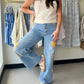 Not your average jeans. The Star Patch Washed Stretch Denim is a conversation starter — a relaxed straight-leg silhouette dressed up with multicolor star patchwork in a playful mix of gingham, solid, and printed fabrics that make every pair feel one-of-a-kind.

The washed finish gives them that perfectly broken-in feel right out of the gate, while the stretch denim blend keeps things comfortable all day long. Five-pocket styling keeps it classic where it counts.

Pair with a simple white tee to let the star