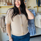 Elevate your casual wardrobe with this charming taupe waffle sweater cardigan. Featuring a classic v-neck, decorative starfish buttons, and comfortable half sleeves, this piece offers effortless style for any season. The textured waffle knit adds visual interest while maintaining a timeless, versatile look that pairs beautifully with jeans, skirts, or layered outfits. Perfect for layering or wearing solo.