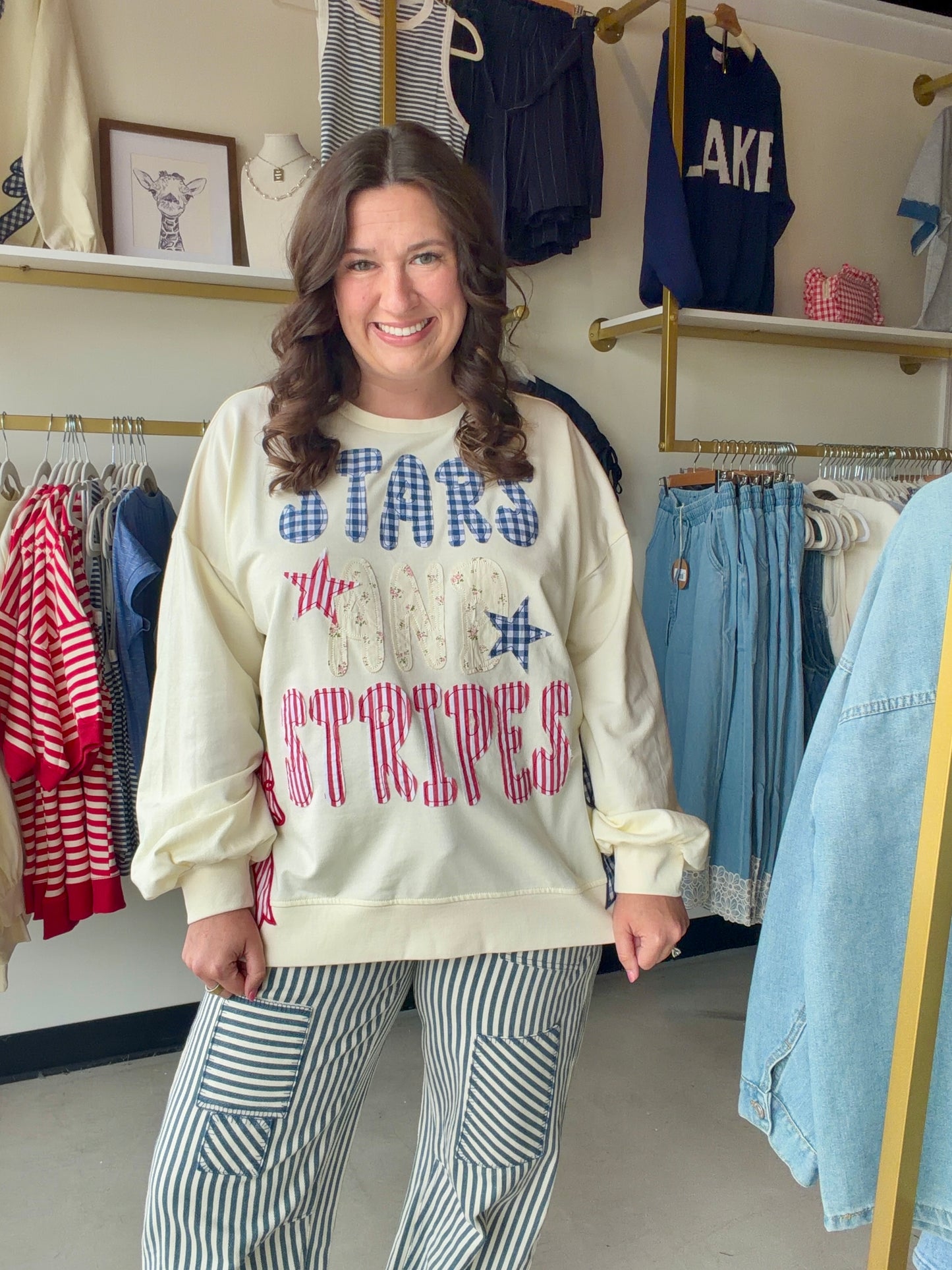 Bibi

Celebrate in style with this premium Bibi French terry sweatshirt featuring vintage-inspired "Stars and Stripes" patchwork and a trendy gingham side-bow accent. This oversized Americana pullover combines ultimate comfort with a festive, boutique-quality design perfect for 4th of July festivities.

Soft premium French terry fabric.
Charming blue gingham side-bow detail.
Unique mixed-print vintage patchwork lettering.
Relaxed, oversized fit for comfort.
Festive Americana stars and stripes.
High-quality 