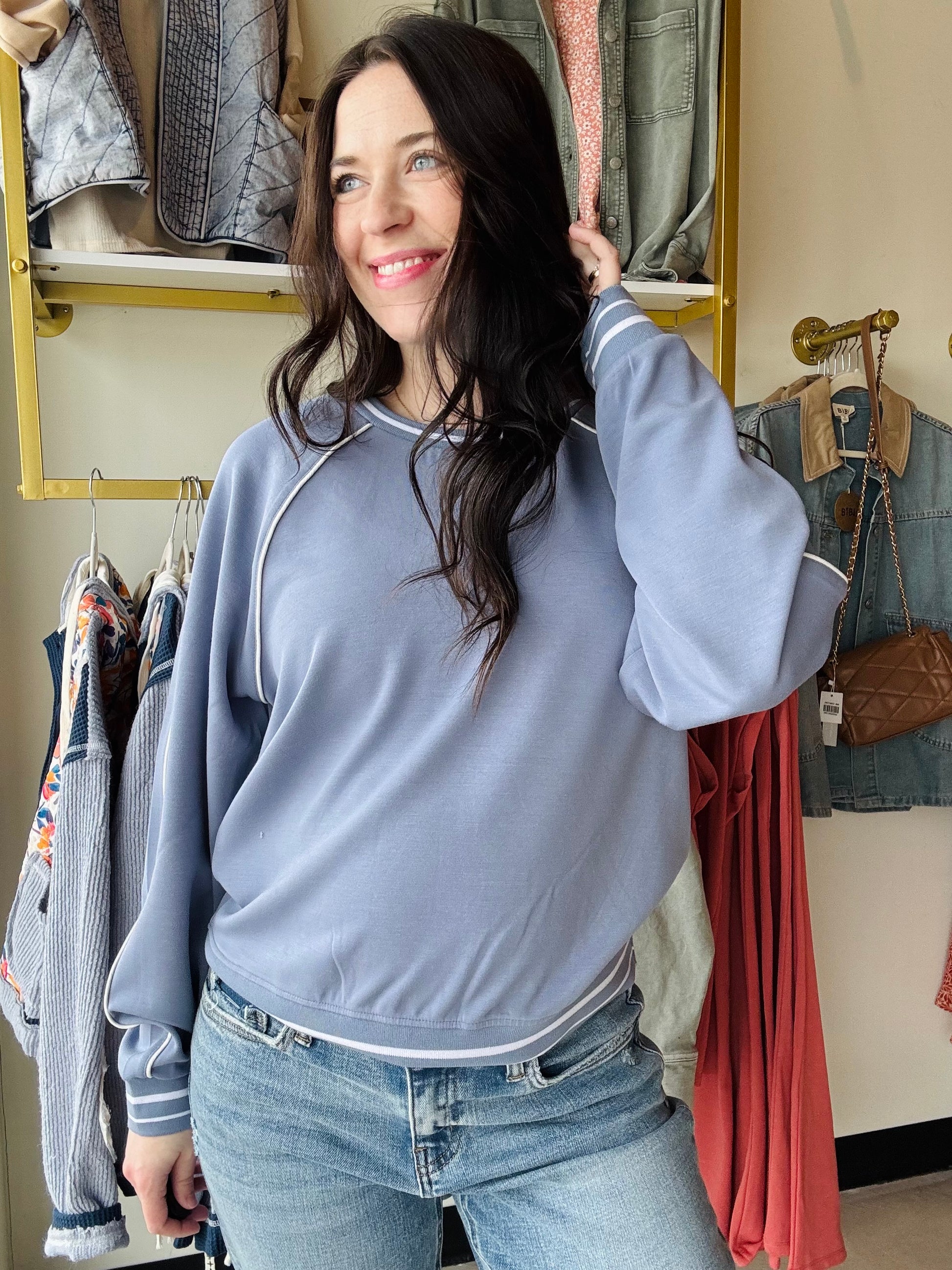 Thread &amp; Supply

Comfy with a touch of sport, this buttery soft pullover is featured in a relaxed, oversized fit with contrast pipping and crew neckline.

Raglan sleeves
Contrast stitching
Loose fit
Rounded neckline
Measurements for a size small:

Length: 24"&nbsp;
Chest: 21"
Sweep: 18 1/4"
Sleeve length: 28.5"