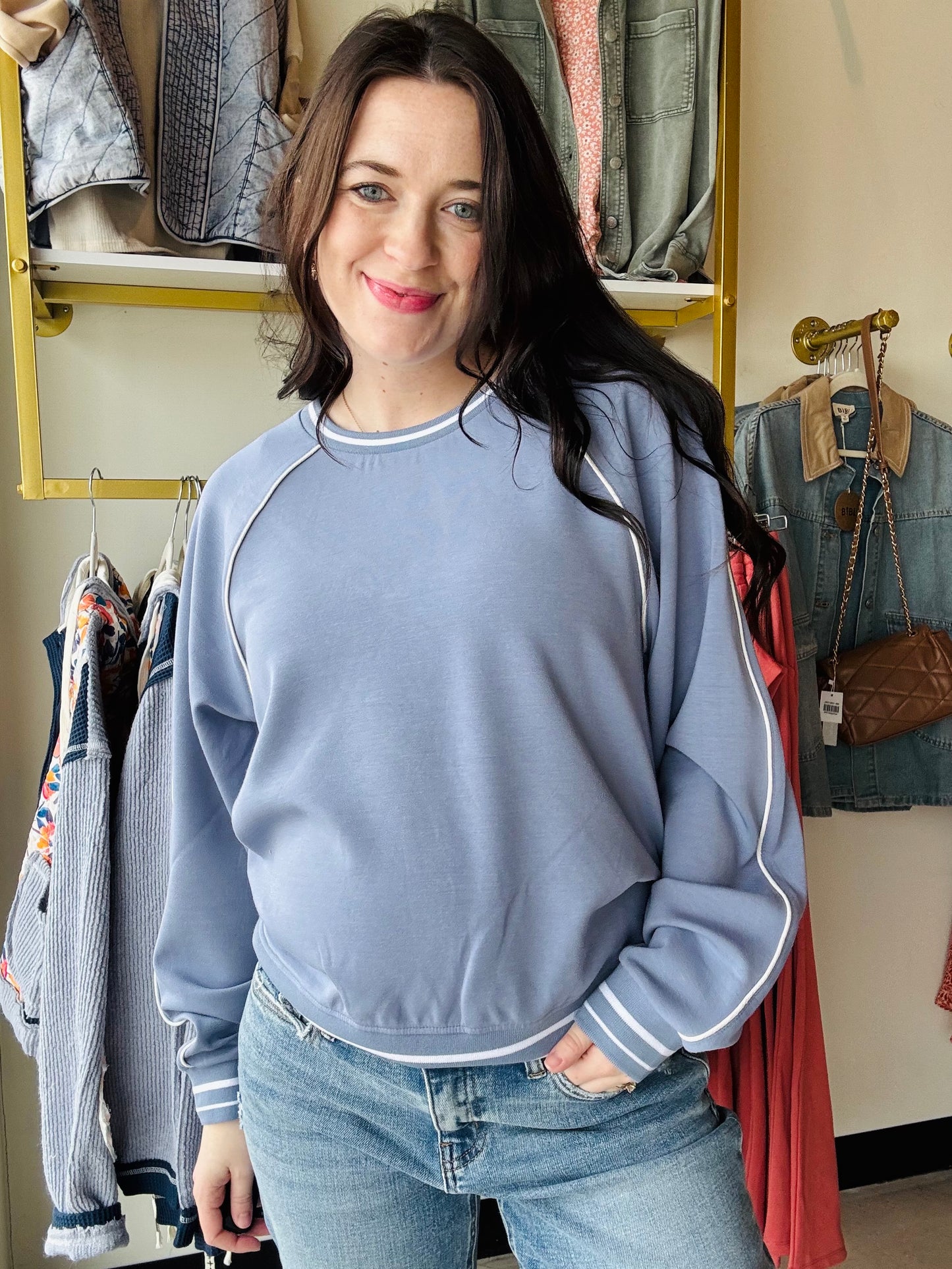 Thread &amp; Supply

Comfy with a touch of sport, this buttery soft pullover is featured in a relaxed, oversized fit with contrast pipping and crew neckline.

Raglan sleeves
Contrast stitching
Loose fit
Rounded neckline
Measurements for a size small:

Length: 24"&nbsp;
Chest: 21"
Sweep: 18 1/4"
Sleeve length: 28.5"