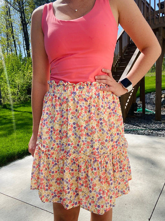 This Summer Garden Tiered Skirt is perfect for both office and leisure situations. The skirt features an elastic waist for comfort and light weight fabric for breathability and ease. With its modest length and feminine style, you can stay cool and classy throughout the day.