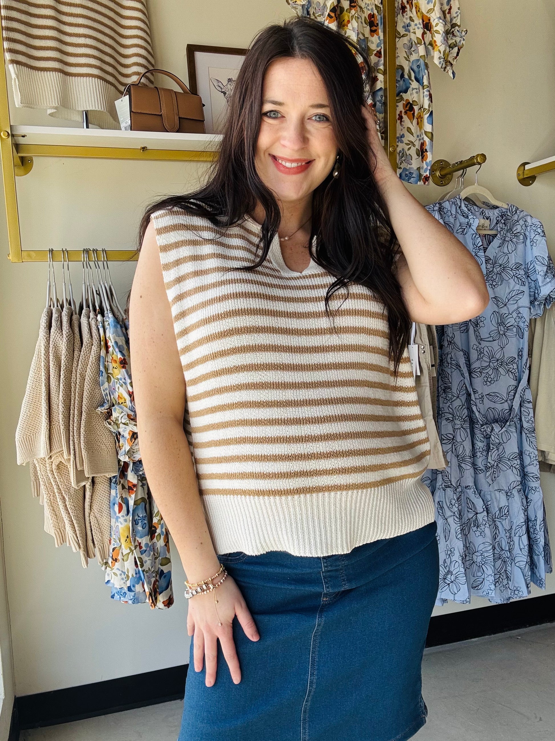 Staccato

This ivory and taupe striped sweater features a striking Y split neckline and cap sleeves for contemporary style. Ribbed contrast trim adds polished detailing throughout. Style it with denim and your favorite jean or linen jacket for an effortless look that works beautifully all spring and summer long. A versatile essential that transitions seamlessly from casual to refined.