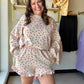Very J

Experience cloud-like comfort in this ultra-soft floral knit set, blending feminine charm with a relaxed silhouette. The dreamy taupe and pink print pairs an effortless oversized top with flirty ruffled shorts for the ultimate "stay-at-home chic" look. Perfect for slow mornings and stylish weekend unwinding.

Buttery-soft knit for total relaxation.
Oversized fit provides effortless comfort.
Flirty ruffled hem adds feminine flair.
Stretchy elastic waist fits you perfectly.
Functional side pockets for