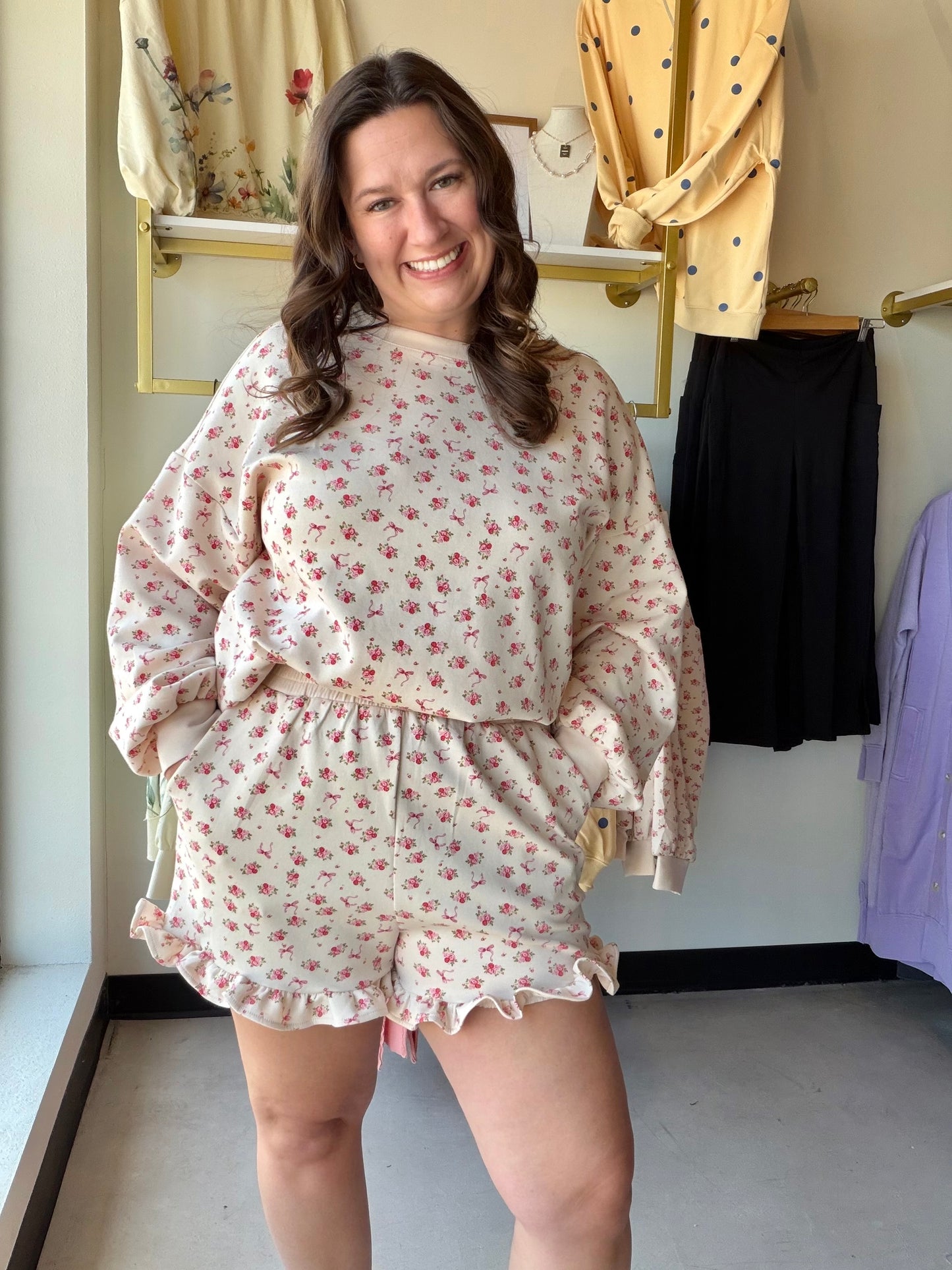 Very J

Experience cloud-like comfort in this ultra-soft floral knit set, blending feminine charm with a relaxed silhouette. The dreamy taupe and pink print pairs an effortless oversized top with flirty ruffled shorts for the ultimate "stay-at-home chic" look. Perfect for slow mornings and stylish weekend unwinding.

Buttery-soft knit for total relaxation.
Oversized fit provides effortless comfort.
Flirty ruffled hem adds feminine flair.
Stretchy elastic waist fits you perfectly.
Functional side pockets for