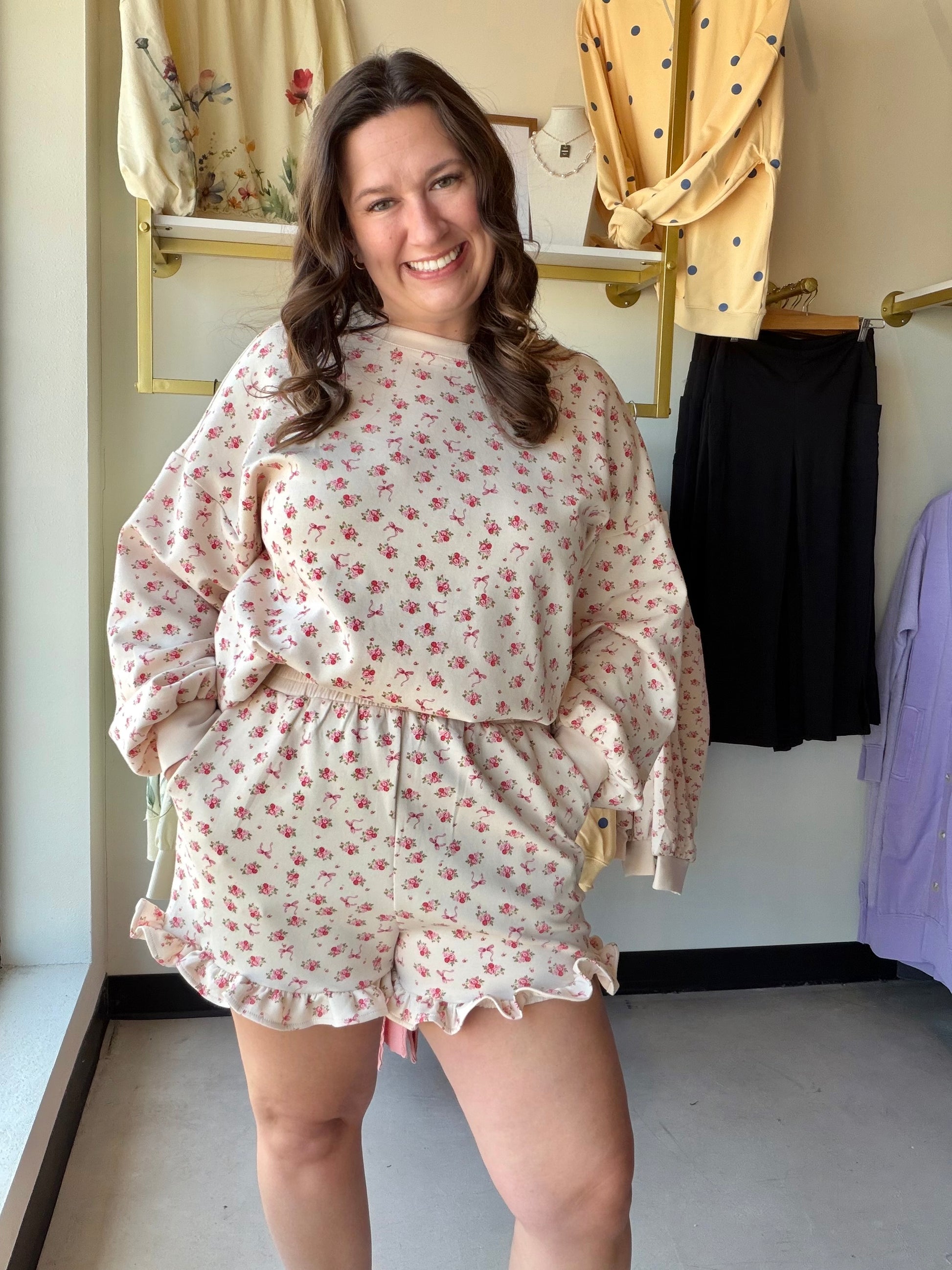 Very J

Experience cloud-like comfort in this ultra-soft floral knit set, blending feminine charm with a relaxed silhouette. The dreamy taupe and pink print pairs an effortless oversized top with flirty ruffled shorts for the ultimate "stay-at-home chic" look. Perfect for slow mornings and stylish weekend unwinding.

Buttery-soft knit for total relaxation.
Oversized fit provides effortless comfort.
Flirty ruffled hem adds feminine flair.
Stretchy elastic waist fits you perfectly.
Functional side pockets for
