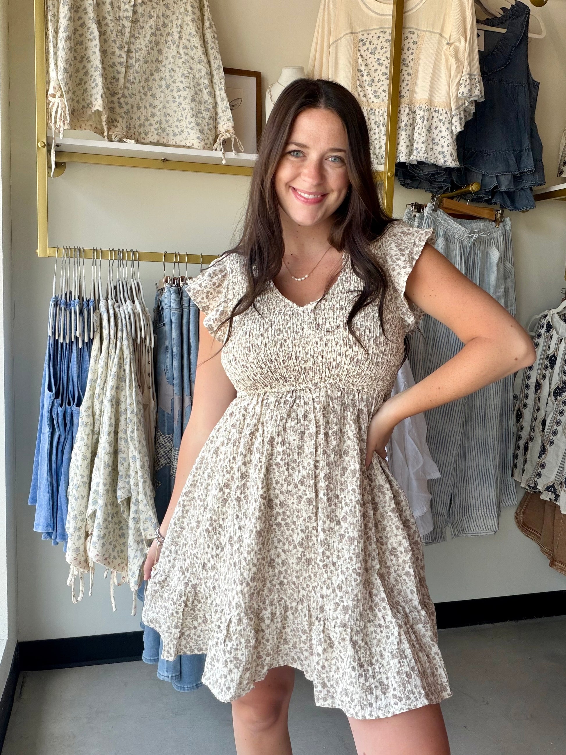 Hem &amp; Thread&nbsp;

Soft, sweet, and completely effortless. The Taupe Smocked Babydoll Dress is the kind of dress you reach for when you want to look put-together without putting in the work.

A smocked bodice fits and flatters beautifully, then flows into a relaxed babydoll silhouette that's breezy and comfortable all day long. Ruffle sleeves add a delicate, feminine touch, and the fully lined body means it drapes and moves exactly the way a great dress should. The warm taupe hue is endlessly versatile