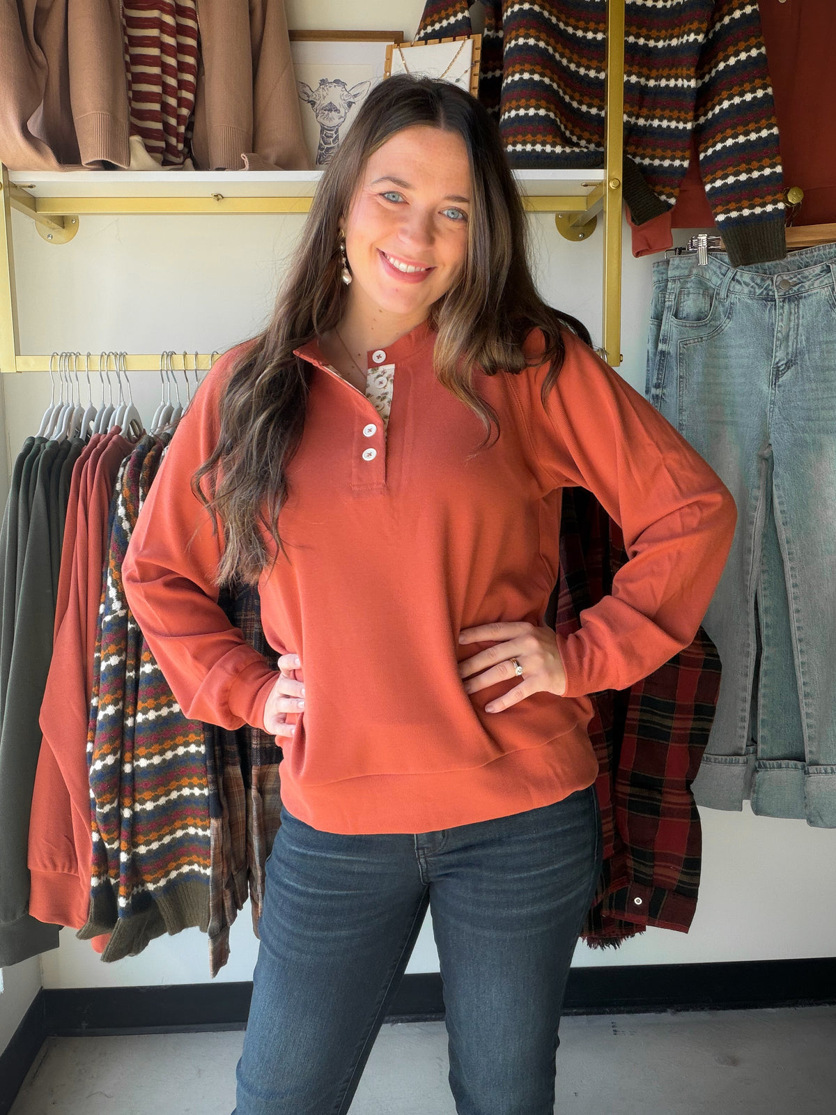 The Terracotta Floral Neckline Henley from Staccato puts a romantic spin on a wardrobe staple. A classic henley silhouette gets a fresh update with a floral-printed placket neckline, set against a solid terracotta backdrop that flatters everything from faded denim to dark neutrals.

Why You'll Love It

Henley styling with a feminine floral-printed placket neckline
Long sleeves in a solid terracotta tone
A small detail that elevates an everyday silhouette
Styling Ideas

Half-tuck it into light-wash jeans wit