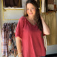 The perfect warm-toned essential. The Terracotta Ribbed V-Neck Tee from POL is the kind of top that works harder than it looks — a relaxed, roomy silhouette with a textured ribbed knit, flattering V-neckline, and thoughtful details that elevate a simple short sleeve.

An extended back hem adds coverage and movement, while the exaggerated side slits give it that effortless, fashion-forward edge. Wear it tucked, half-tucked, or let it flow — it's endlessly versatile.

V-neckline with short sleeves
Roomy, over