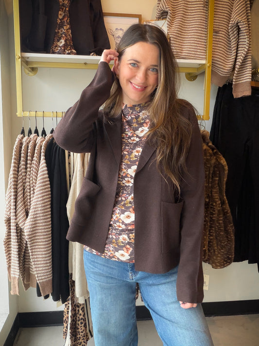 Thread &amp; Supply

Notched lapel collar
Open-front design
Two front patch pockets
Long sleeves
Knit fabric with a touch of cashmere
Color: Espresso
Fabric: 40% viscose, 35% polyester, 20% nylon, 5% cashmere.
