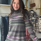 Tribal

Wrap yourself in cozy charm with the Pink Flambe Mock Neck sweater. Its super soft striped fabric feels like a gentle hug, while the playful mock neckline adds a touch of fun flair. Perfect for layering, it pairs beautifully with a vest to keep you warm and stylish on chilly days.