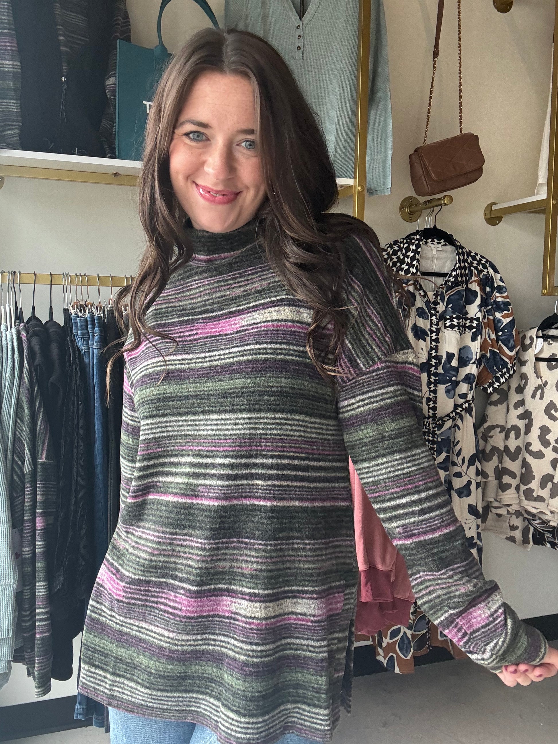 Tribal

Wrap yourself in cozy charm with the Pink Flambe Mock Neck sweater. Its super soft striped fabric feels like a gentle hug, while the playful mock neckline adds a touch of fun flair. Perfect for layering, it pairs beautifully with a vest to keep you warm and stylish on chilly days.