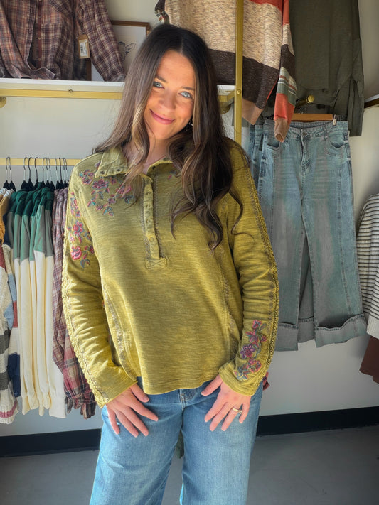 A Little Floral, A Lot of Everyday Charm

Your casual days deserve pretty details, too. This olive top from Tru Luxe Jeans pairs a washed, lived-in look with colorful floral embroidery for an easy outfit that feels anything but basic. A classic collar and partial snap front add a polished touch, while the long sleeves feature delicate openwork trim that makes this piece special from every angle.

Slip it on with your favorite washed denim and ankle boots for a coffee date or an afternoon browsing the shops.