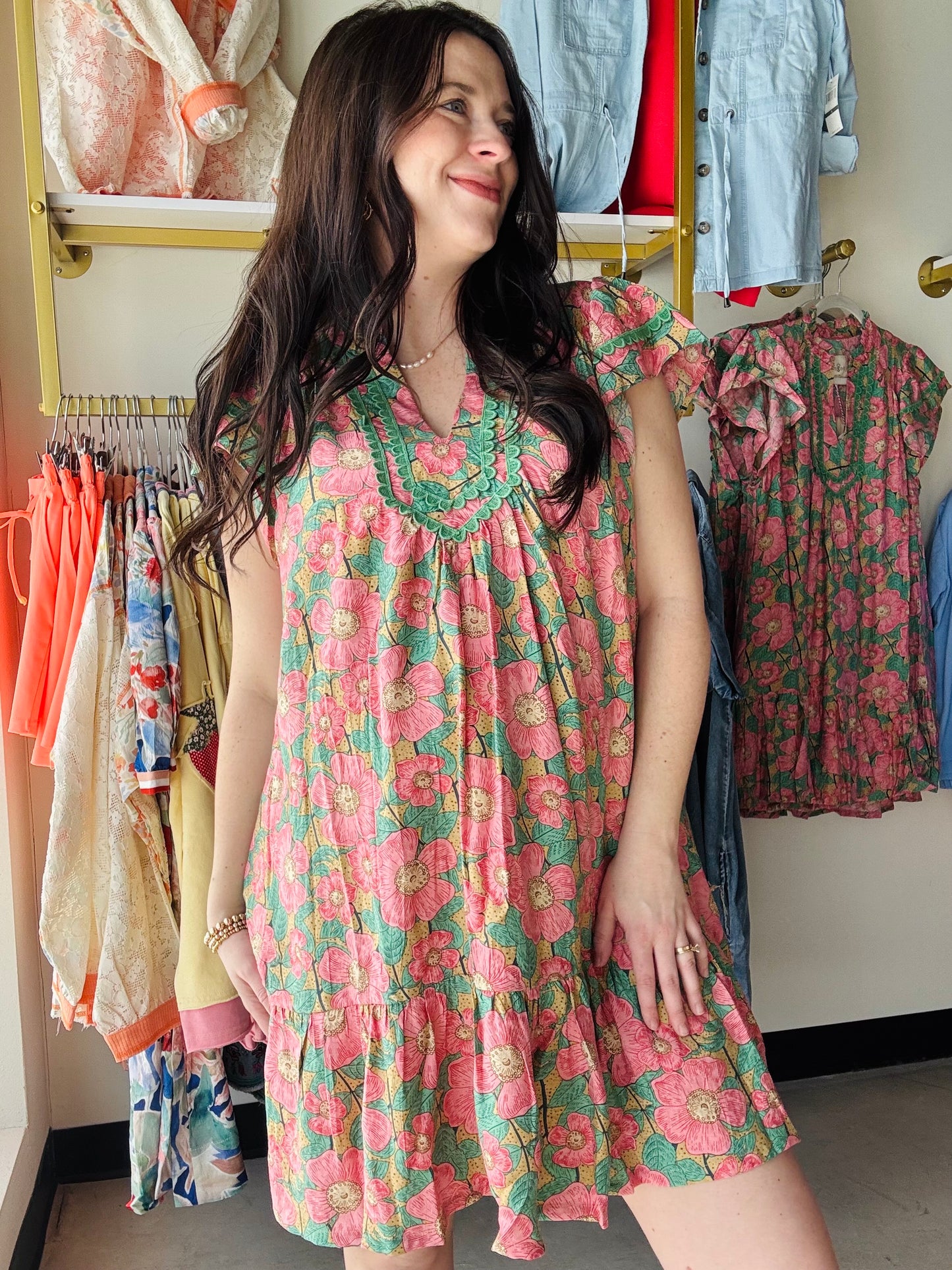 Umgee

Abstract Print Tiered Mini Dress

Key Features
• Abstract print 
• Short flutter sleeves
• Lace trims 
• Tiered mini length
• Lined 

Fit &amp; Model Notes
Sophie is 5'4", 26 weeks&nbsp;pregnant, and wearing the size small.
