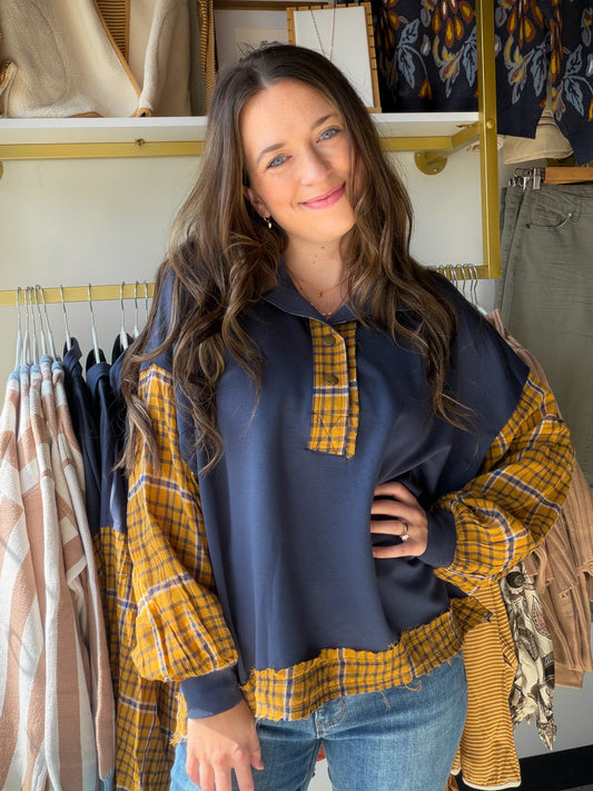 Like a favorite autumn memory stitched into fabric. The&nbsp;Navy Plaid Luxeknit Long Sleeve Pullover by Umgee wraps you in buttery-soft LuxeKnit fabrication with a timeless plaid contrast that feels both classic and effortlessly current. The kind of top you'll reach for on every crisp morning, cozy weekend, or low-key night in.

Why You'll Love It

Signature LuxeKnit fabrication — buttery-soft and comfortable all day long
Navy plaid contrast detail — timeless pattern with a modern feel
Long sleeves for eff