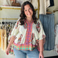Umgee

Embrace effortless bohemian elegance with this vibrant Umgee paisley top, featuring a flattering split V-neck and airy 3/4 puff sleeves. This lightweight, scalloped-hem beauty is your new go-to for chic, sun-drenched days and boutique-style flair.

Breathable fabric for all-day comfort.
Flattering V-neck elongates your silhouette.
Chic puff sleeves add feminine volume.
Intricate scalloped hem for boutique detail.
Flowy relaxed fit flatters every figure.
Vibrant paisley print demands attention.