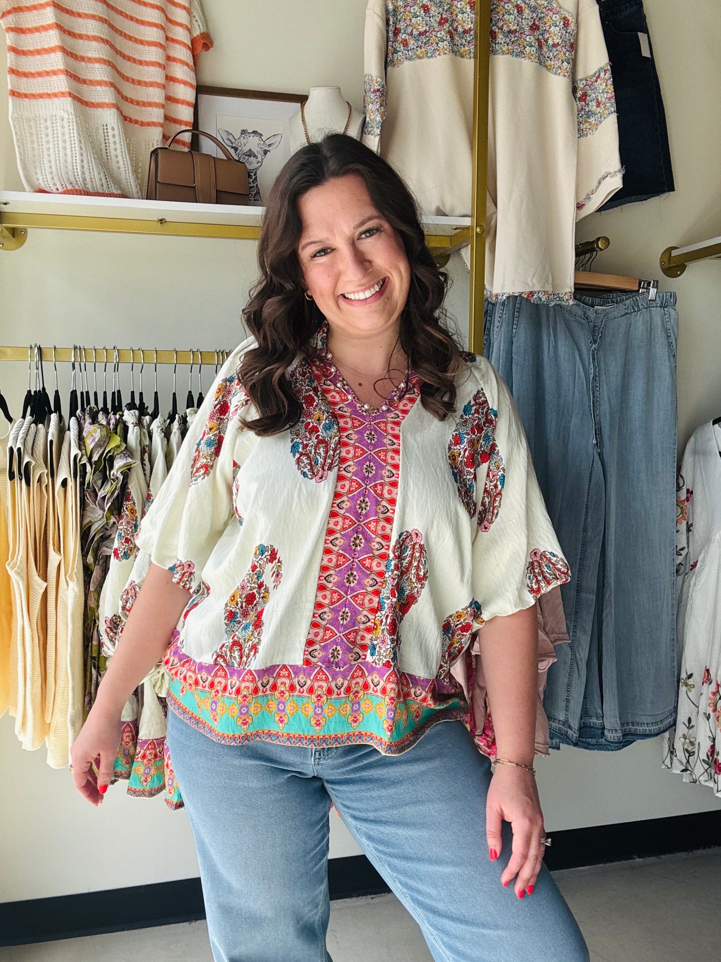 Umgee

Embrace effortless bohemian elegance with this vibrant Umgee paisley top, featuring a flattering split V-neck and airy 3/4 puff sleeves. This lightweight, scalloped-hem beauty is your new go-to for chic, sun-drenched days and boutique-style flair.

Breathable fabric for all-day comfort.
Flattering V-neck elongates your silhouette.
Chic puff sleeves add feminine volume.
Intricate scalloped hem for boutique detail.
Flowy relaxed fit flatters every figure.
Vibrant paisley print demands attention.