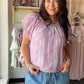 Feminine, flirty, and made for warm-weather dressing — the Pink Floral Puff Sleeve Top by Umgee is the kind of piece that makes getting dressed feel effortless. A vibrant floral print meets a relaxed, flowy silhouette, while short puff sleeves and delicate pleat and gathered details add a romantic, editorial touch. Wear it tucked into your favorite denim or let it flow for an easy, breezy look.

Details:

Floral print throughout
Short puff sleeves with lined construction
Round neckline with gathered detail
