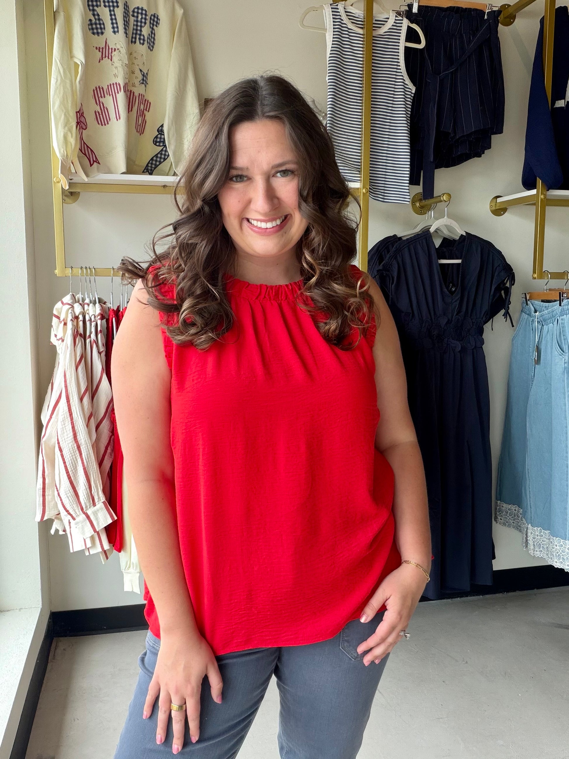 Umgee

Elevate your everyday style with this vibrant red Umgee tank, featuring a feminine ruffled neckline and a modern boxy silhouette. This lightweight sleeveless top blends bold color with a sophisticated, breezy fit that transitions perfectly from desk to dinner.

Chic ruffled neckline adds feminine detail.
Relaxed boxy fit for ultimate comfort.
Flattering subtle hi-low hemline.
Bold red hue makes a statement.
Lightweight, breathable 100% polyester fabric.
Elegant ruffle-trimmed armholes.
Effortless sty