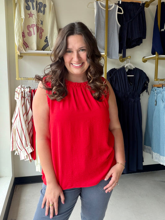 Umgee

Elevate your everyday style with this vibrant red Umgee tank, featuring a feminine ruffled neckline and a modern boxy silhouette. This lightweight sleeveless top blends bold color with a sophisticated, breezy fit that transitions perfectly from desk to dinner.

Chic ruffled neckline adds feminine detail.
Relaxed boxy fit for ultimate comfort.
Flattering subtle hi-low hemline.
Bold red hue makes a statement.
Lightweight, breathable 100% polyester fabric.
Elegant ruffle-trimmed armholes.
Effortless sty