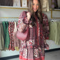 Umgee

Mix Patchwork Print Tiered Long Sleeve Dress

Key Features
• Mixed patchwork-inspired print
• Long balloon sleeves
• Ruffle-trimmed elastic cuffs
• Tiered ruffle hem
• Side pockets 
• Lined&nbsp;

Fabric Contents
• 85% Rayon
• 15% Nylon
