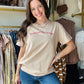 Southern Grace

Fit: Relaxed
Runs Large
Unlined
Some Stretch
Crew Neck
Standard T-Shirt Length
Printed in Texas
Fabric &amp; Care

Material: 100% Cotton
Care Instructions: Hand Wash with Cold Water, Do Not Bleach, Hang or Line Dry