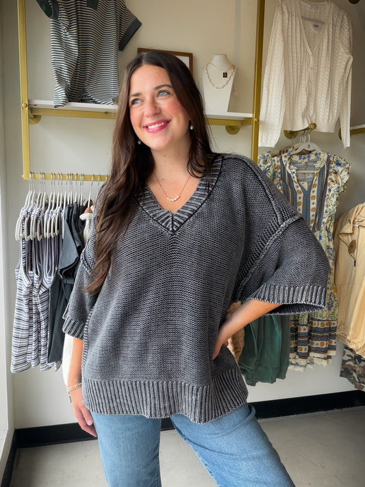 Turn every weekend into a long weekend. The Vintage Charcoal V-Neck Sweater by Cotierra is your new go-to for effortless, cozy style. Made from 100% soft cotton knit, it has that perfectly broken-in feel from the very first wear — the kind of sweater you'll never want to take off.

A classic ribbed V-neckline, casual drop shoulders, and a split hem give it a relaxed, lived-in silhouette that works just as well with jeans as it does with leggings. Ribbed trim on the cuffs, collar, and hem adds a polished fin