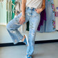 Meet your new favorite statement denim. The Vintage Floral High Rise Wide Leg by Vervet by Flying Monkey combines a bold floral print with a super high-rise waist and extreme vintage flare silhouette — effortlessly editorial, undeniably cool.

Crafted in non-stretch denim for a structured, vintage-authentic feel, these jeans feature a flattering 11" front rise, five-pocket styling, a finished hem, and a sweeping 22" leg opening that commands attention.

Super high-rise waist (11" front rise)
Extreme vintage