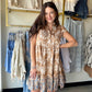 Hem &amp; Thread&nbsp;

A dress that feels like a vacation. The Mocha Vintage Border Tiered Dress is a mini with major personality — a vintage-inspired border print flows through each tiered layer, giving it that effortlessly cool, retro-boho energy that's impossible to replicate.

Flutter sleeves and a flattering V-neckline keep it feminine and breezy, while the soft rayon-blend fabric drapes beautifully and feels lightweight against the skin. The tiered silhouette adds movement and volume that looks stunn