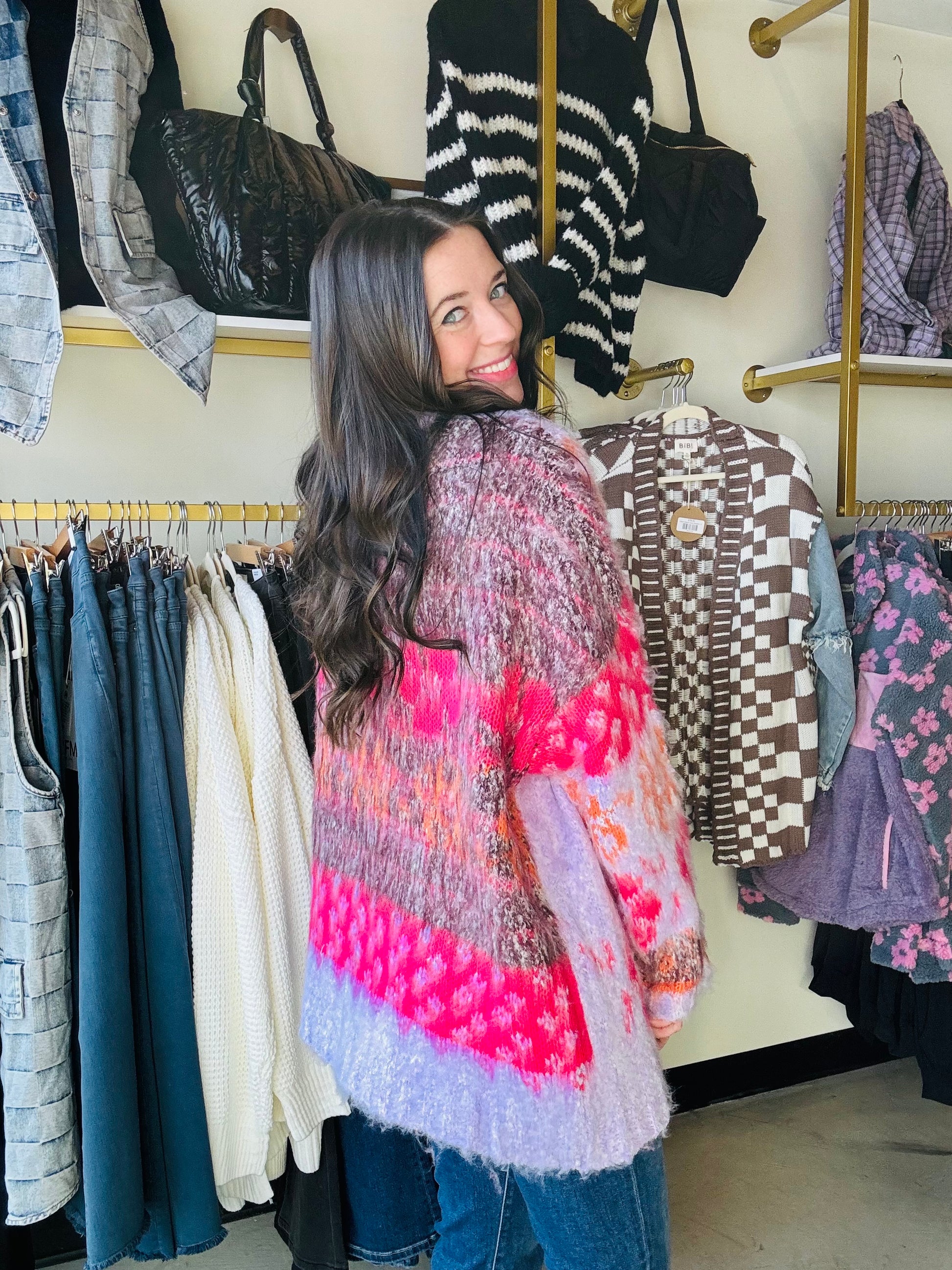 Wrap yourself in the cozy comfort and whimsical charm of our Pink Motif Fuzzy Cardigan. The oversized floral knit adds a playful touch while the open-front silhouette and ribbed hemlines provide a relaxed fit. With drop shoulder long sleeves and a fuzzy textured knit, this cardigan is the perfect addition to your wardrobe.