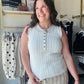 Cotierra

Elevate your everyday wardrobe with this Cotierra white pointelle sweater tank, featuring delicate scalloped trim and a classic henley button front. This breathable, high-neck knit offers the perfect blend of feminine charm and sophisticated comfort for effortless summer styling.

Chic scalloped trim adds feminine flair.
Breathable pointelle knit for all-day comfort.
Functional buttons for versatile styling.
Sophisticated high neckline looks polished.
Lightweight fabric perfect for layering.
Timel