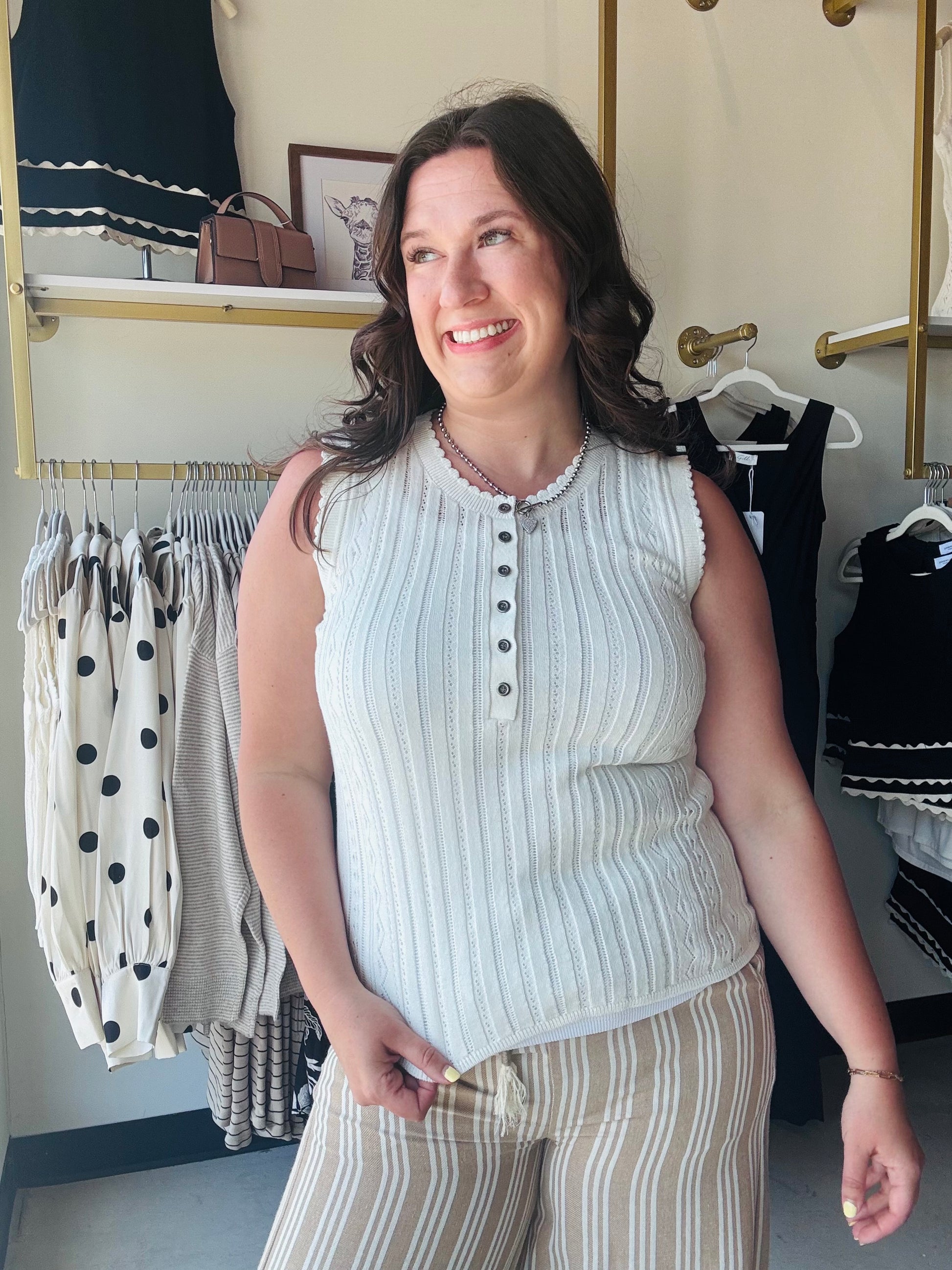 Cotierra

Elevate your everyday wardrobe with this Cotierra white pointelle sweater tank, featuring delicate scalloped trim and a classic henley button front. This breathable, high-neck knit offers the perfect blend of feminine charm and sophisticated comfort for effortless summer styling.

Chic scalloped trim adds feminine flair.
Breathable pointelle knit for all-day comfort.
Functional buttons for versatile styling.
Sophisticated high neckline looks polished.
Lightweight fabric perfect for layering.
Timel
