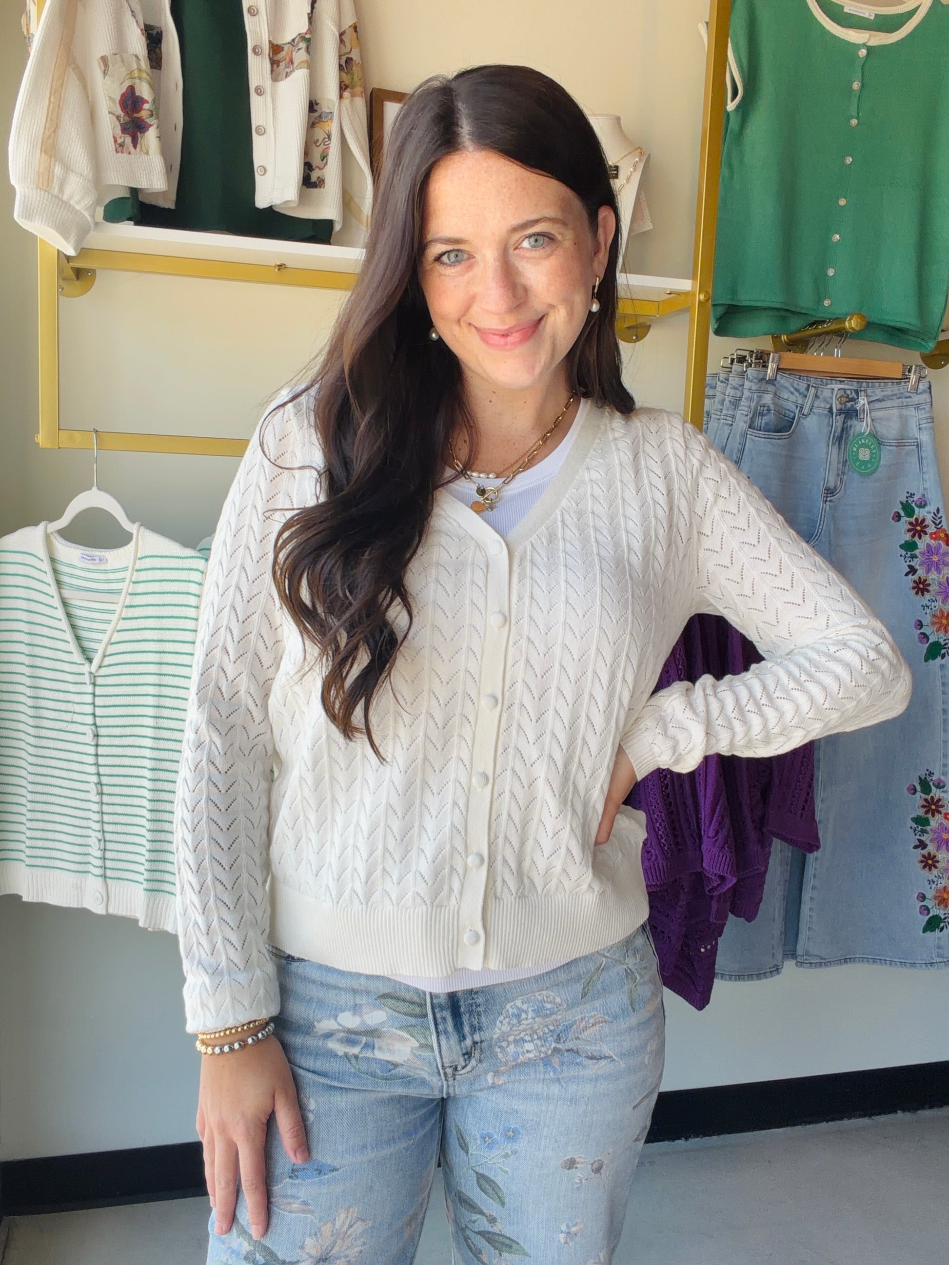 The effortless layer your wardrobe has been waiting for. The White Pointelle Button Down Cardigan by Staccato features delicate pointelle detailing, a classic V-neck, and a full button-down front — equal parts cozy and polished.

In a crisp white and crafted from 100% cotton, this long-sleeve cardigan transitions seamlessly from a breezy summer evening to a cool-weather layering piece. Wear it open as a lightweight topper or buttoned up as a standalone top.

Pointelle knit detailing
Long sleeve, V-neck silh