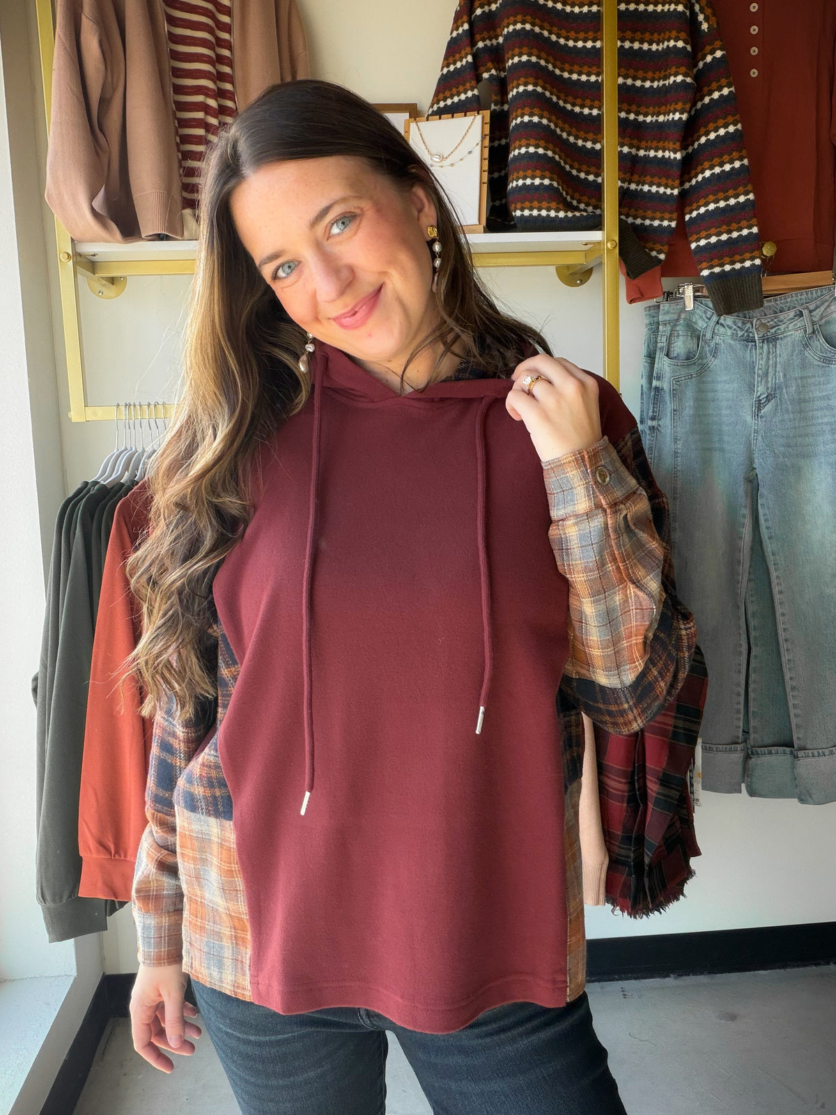 The Plaid Wine Accent Hoodie from Staccato is not your average hoodie. A drawstring hood and long sleeves meet a plaid shirt insert for a layered look without the layers, all in a soft, micro-brushed fabric in rich wine tones. It's the piece that makes a plain Tuesday feel a little more put together.

Why You'll Love It

Drawstring hoodie with long sleeves
Plaid shirt insert adds a layered, mixed-pattern look
Soft, micro-brushed fabric for cozy everyday wear
Rich wine accent palette
Styling Ideas

Throw it 