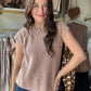 Wishlist&nbsp;

This Dusty Rose Cap Sleeve Sweater features a refined rose hue and vertical ribbing that enhances its tailored silhouette. Crafted from 100% cotton, it offers breathable comfort and durability, making it an ideal choice for layering or standalone wear in transitional seasons. The cap sleeves add a subtle, elegant touch suitable for both casual and polished looks.